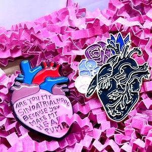 Two anatomical Heart pins with two amethyst rocks. Perfect to share w/ a friend!
